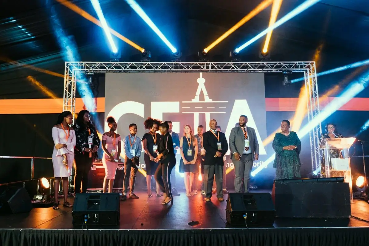 Award ceremony with stage and speakers.